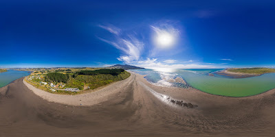 Aerial drone panoramic view, from Raglan Harbour, over the seaside town of Raglan, on the West Coast of the Waikato region in the North Island of New Zealand.. Photography by Mike Walen / KeyImagery Photography. Copyright: © KeyImagery Photography.