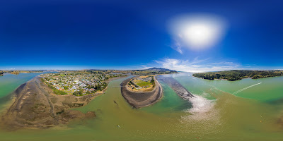 Aerial drone panoramic view, from Raglan Harbour, over the seaside town of Raglan, on the West Coast of the Waikato region in the North Island of New Zealand.. Photography by Mike Walen / KeyImagery Photography. Copyright: © KeyImagery Photography.