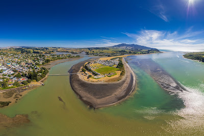 Aerial drone panoramic view over the seaside town of Raglan, on the West Coast of the Waikato region in the North Island of New Zealand.. Photography by Mike Walen / KeyImagery Photography. Copyright: © KeyImagery Photography.